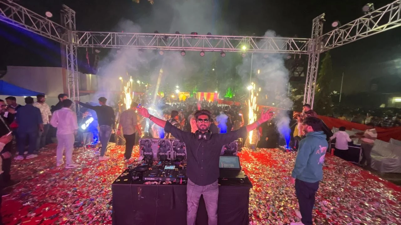 DJ Meet performing at an outdoor celebration with sound and lighting equipment